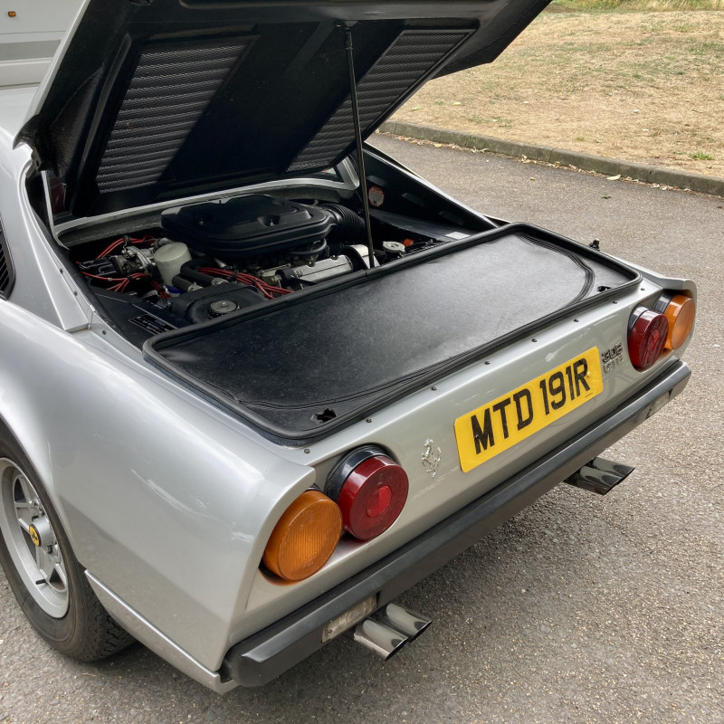 This shows just how ‘mid-engined’ the 308 GTB is. And how much luggage space it has (the full-width zip-up compartment behind). These early fibreglass cars have a dry sumped, carb-fed 3.0-litre V8 that makes about 250hp.