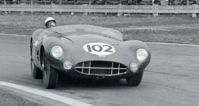 Stirling Moss on his way to winning the 1958 Sussex Trophy at Goodwood driving Aston Martin DBR2/1