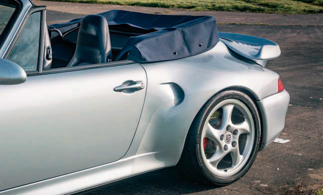 THE GORGEOUSNESS OF THE MODIFIED 993 CABRIOLET BODY WE BEHOLD BELIES THE BARBARIC CRUDITY OF THE OPERATION